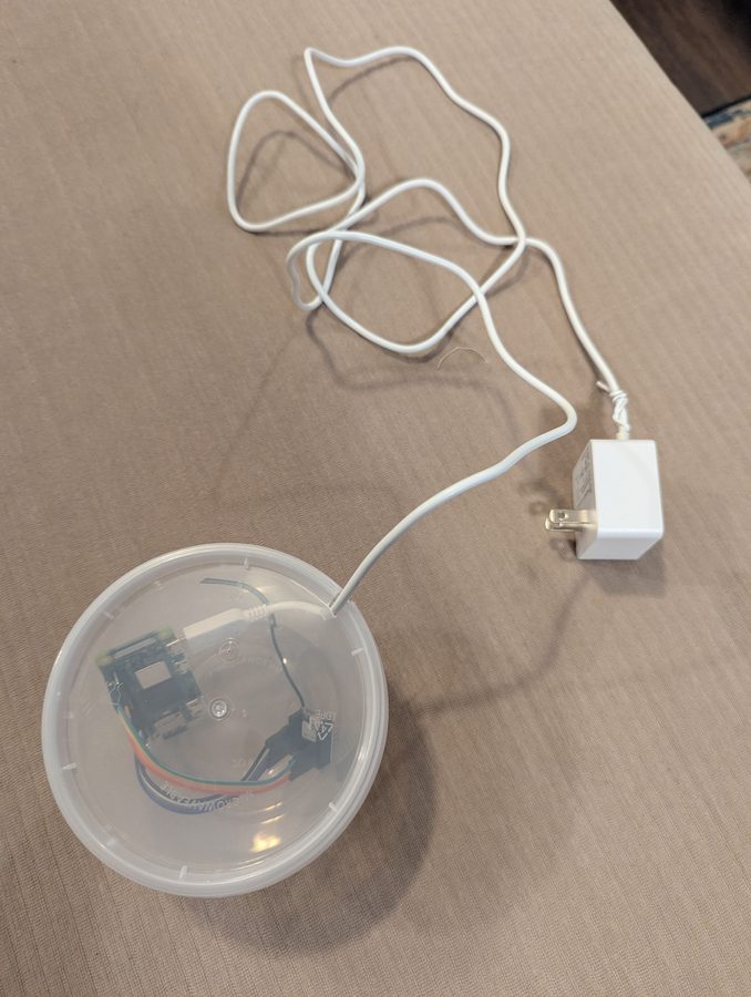 Completed observer unit in clear plastic enclosure, plugged into power