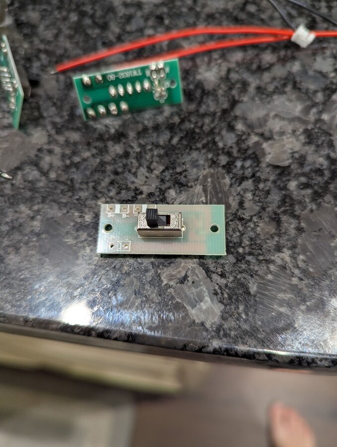 Stripped switch board showing B+ and B- pads