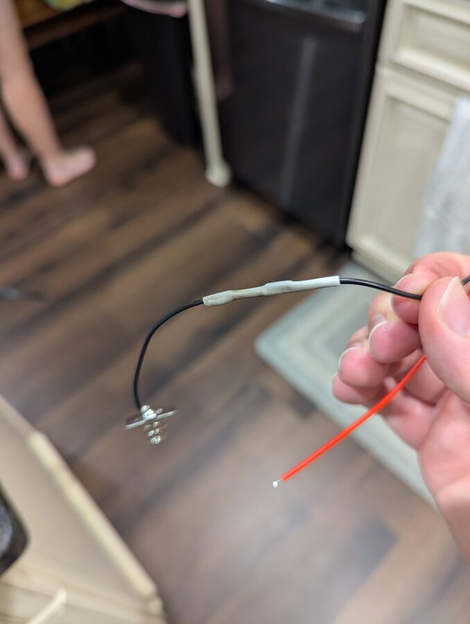 Completed splice with heat shrink applied